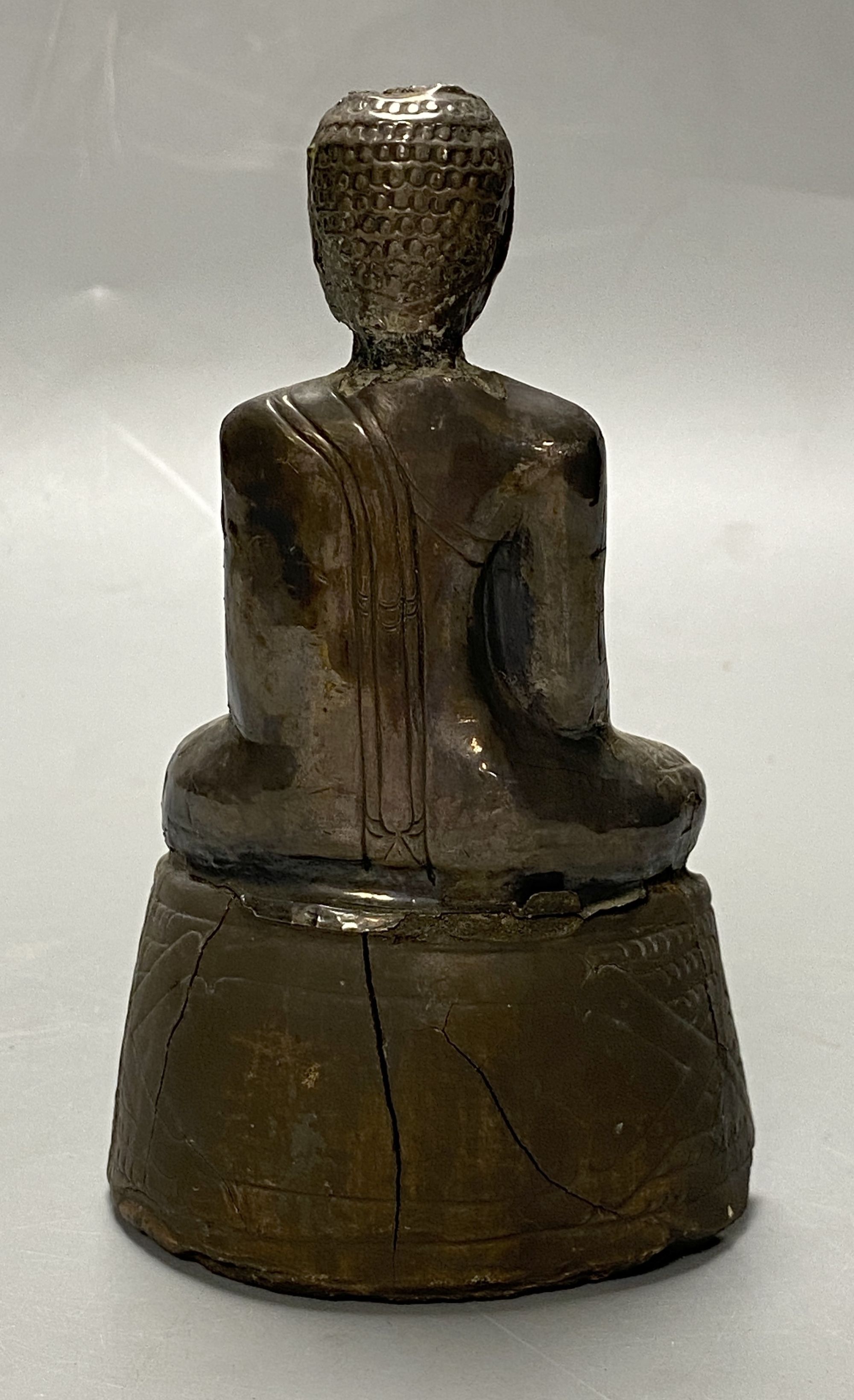 A 19th century Burmese silver overlaid wood figure of Buddha Shakyamuni, height 12cm